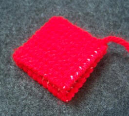 Whip stitch two squares together